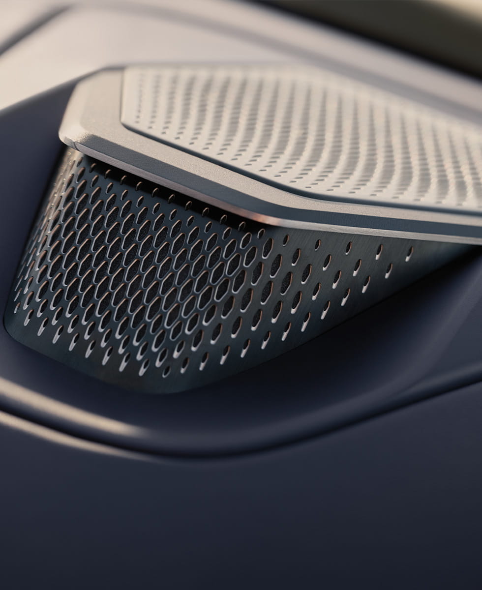 A close up of a Bowers and Wilkins speaker in an Aston Martin Vantage Roadster