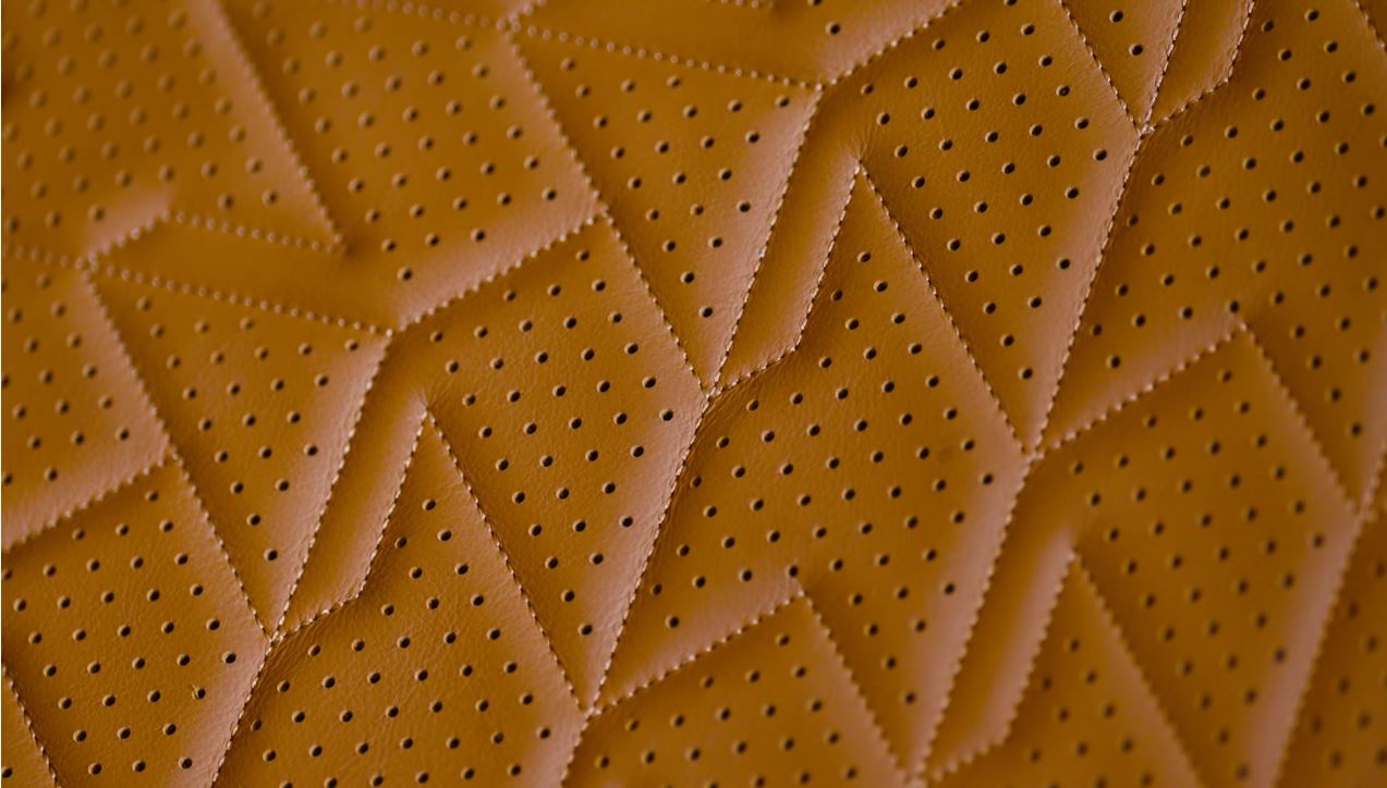 Close up of stitching on Aston Martin vanquish seat