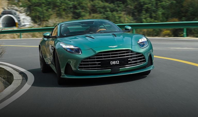 A green DB12 takes a corner